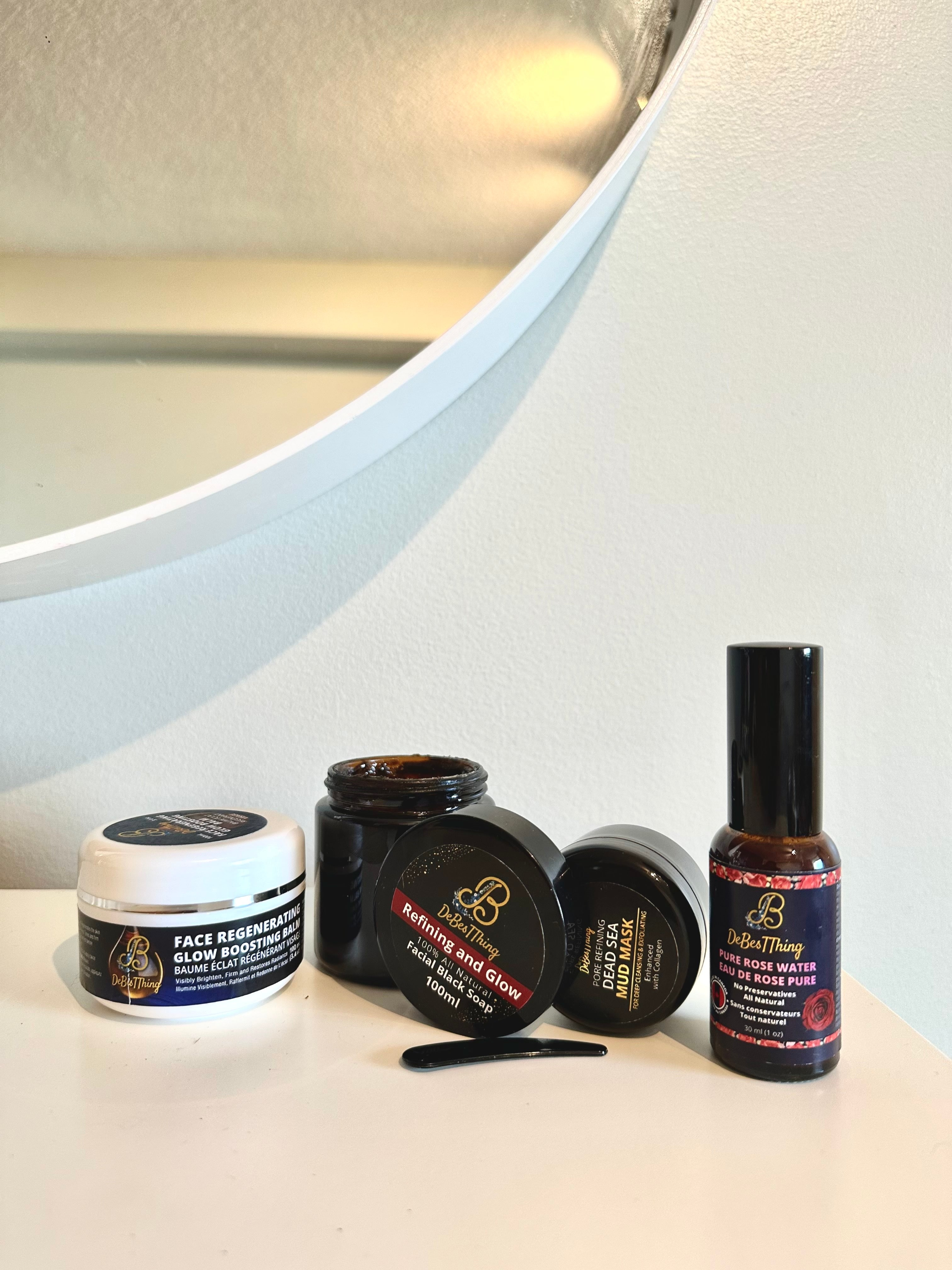 Collection of skincare products on a white surface with a mirror in the background.